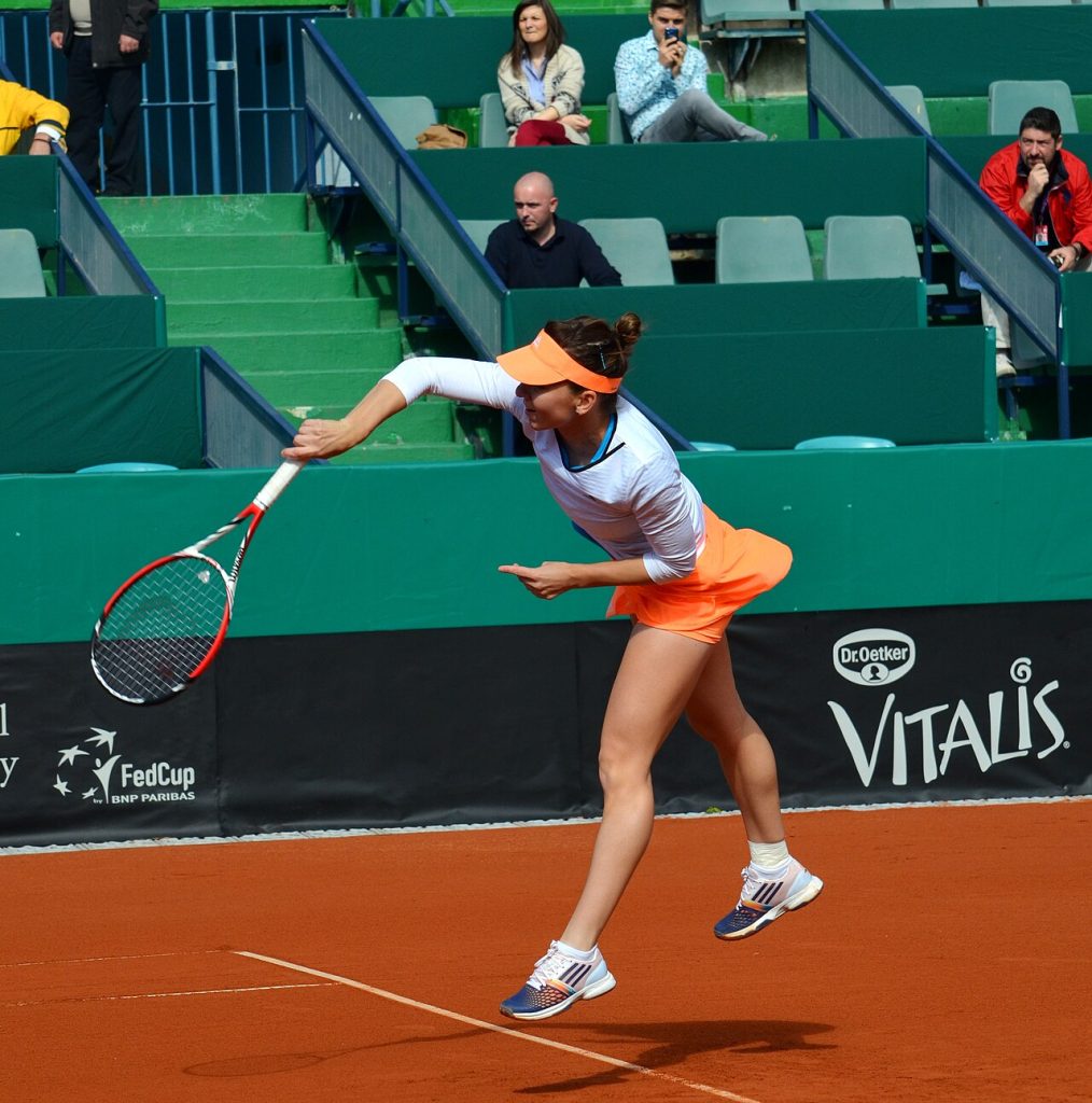 Talia Gibson: Why Australia’s Rising Tennis Star Is Trending A professional tennis player hitting a forehand during a match on clay
