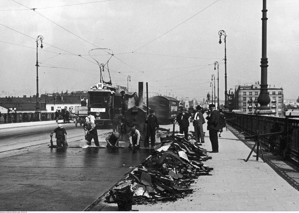workers resurfacing a residential road