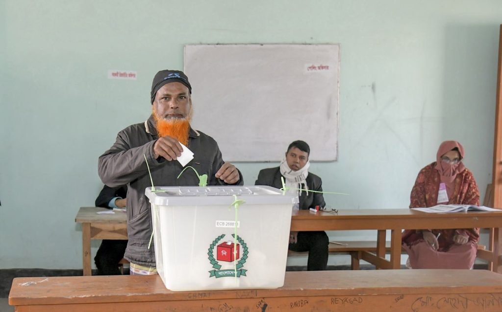 The Turnout Puzzle: Why Voters Stay Home Voters casting their ballots inside a polling station during an election
